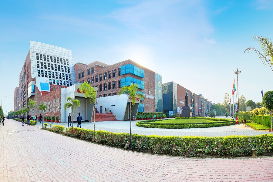 Photograph of LPU's brick-and-glass campus frontage, landscaped courtyard and pedestrian approach